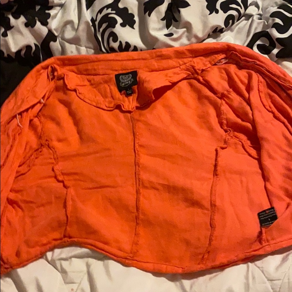 A orange cardigan